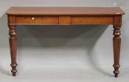 A Victorian mahogany console table, the frieze fitted with two drawers, raised on turned and