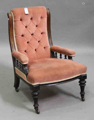 A Victorian oak framed salon armchair, upholstered in pink velour, on turned and fluted legs, height