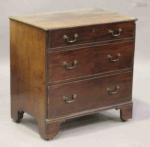 A George III mahogany bachelor's chest of three long drawers, the moulded top above a drawer