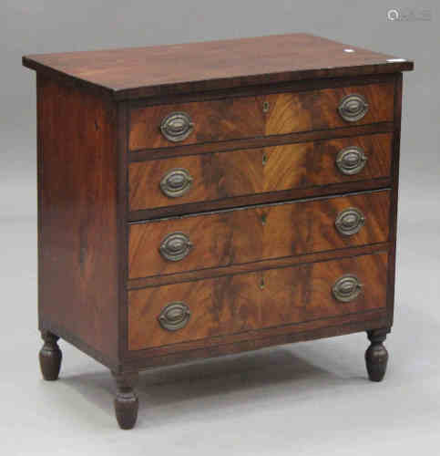 A Regency figured mahogany commode chest with ebony stringing, on turned feet, height 77cm, width