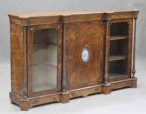A mid-Victorian burr walnut credenza with gilt metal mounts, the breakfront top above a central door