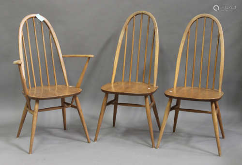A set of three Ercol elm and beech dining chairs, comprising one carver and two standard chairs,