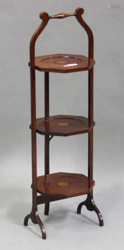 An Edwardian mahogany three-tier folding cake stand with transfer printed fan paterae, height