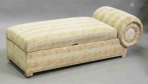 An Art Deco style scroll-end day bed, upholstered in patterned fabric, on block feet, height 52cm,