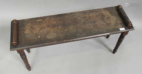 A Victorian oak window seat with turned handles, raised on turned legs, height 46cm, width 93cm,