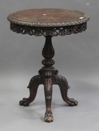 A late 19th/early 20th century Burmese carved padouk circular occasional table, the carved top