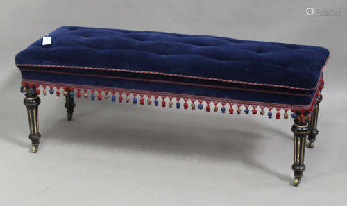 A late Victorian Aesthetic period ebonized and parcel gilt rectangular stool, upholstered in blue