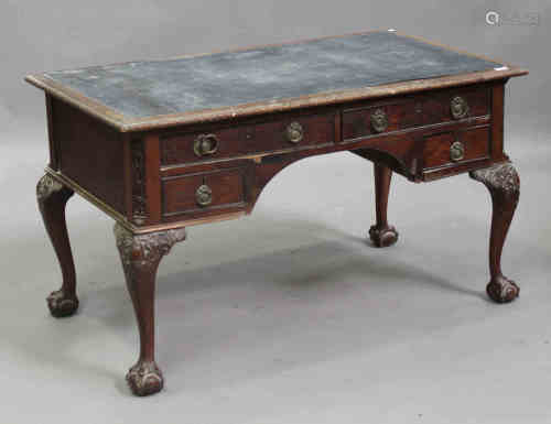 An early 20th century George III style mahogany writing table, the top inset with a black leather