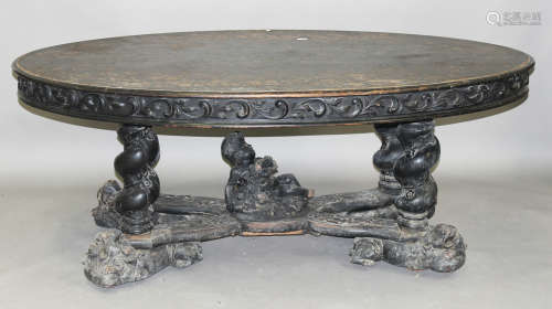 A late Victorian Renaissance Revival stained and carved walnut oval centre table, the top incised