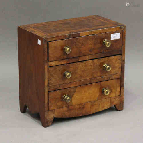 An early 20th century George I style walnut diminutive table-top chest of three long drawers, on