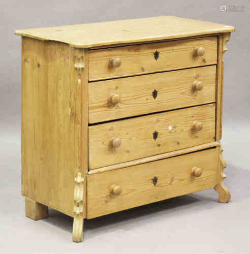 A 20th century Continental pine chest of four long drawers, on shaped scroll feet, height 93cm,
