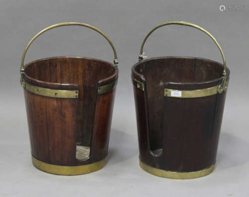 A near pair of 18th century Irish mahogany plate buckets with brass mounts and swing handles, height