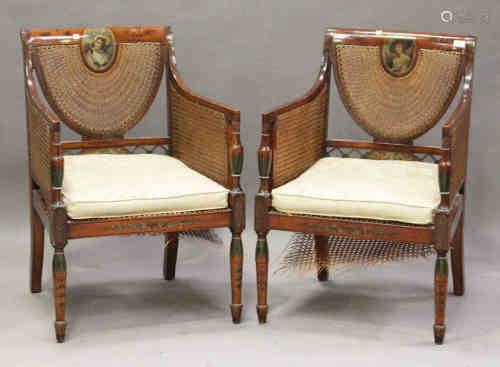 A pair of Edwardian Neoclassical Revival satin birch bergère armchairs with painted decoration,