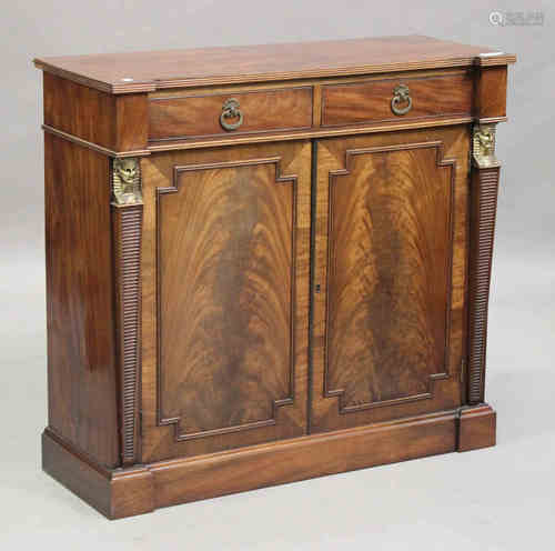 A Regency figured mahogany inverted breakfront side cabinet with Egyptianesque gilt metal mounts,