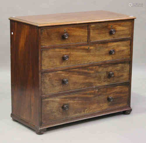 An early Victorian mahogany chest of two short and three graduated long drawers, on bun feet, height