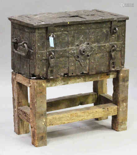 A 17th century Armada type wrought iron chest, the hinged lid and front with overall strapwork,
