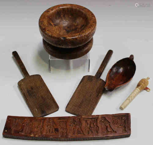 A small group of mainly 19th century treen items, including a carved pine scoop, a burr wood