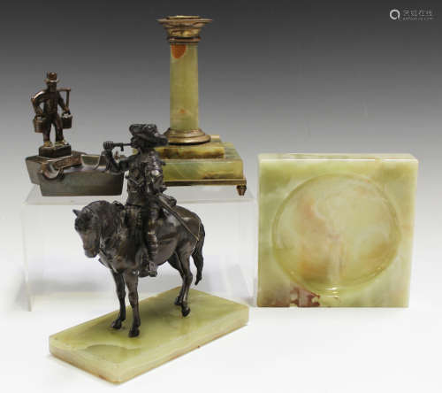 An early 20th century finely cast bronzed metal equestrian figure of a cavalier on horseback,