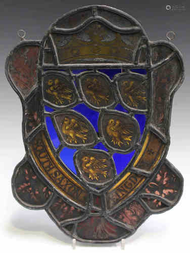 A 19th century stained and leaded glass panel of shaped form, worked as a crowned crest and