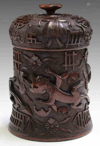 A late 19th century South-east Asian carved hardwood tea canister, probably Singaporean, the domed