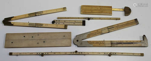 A 19th century ivory and nickel mounted folding measure by J. Rabone & Sons, together with a group