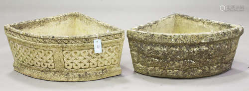 Two similar cast composition stone corner planters, one moulded with guilloche bands and marked '