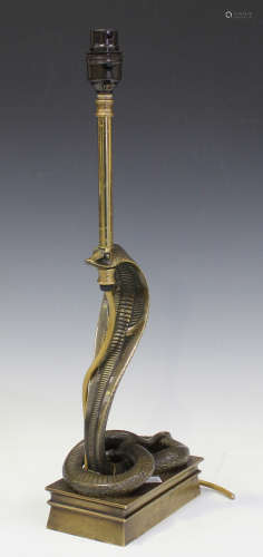 A 20th century cast gilt bronze table lamp in the form of a cobra, raised on a rectangular base,