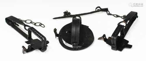 A large group of various wrought metal gin traps and other various forms of spring traps.Buyer’s