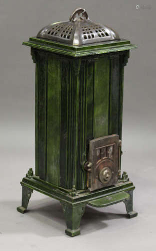 A Belgian Art Deco green enamelled stove, marked 'Unic Les Fonderies Bruxelloises', raised on