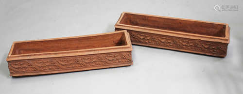 A pair of late 19th/early 20th century terracotta window box planters of rectangular form, three