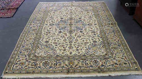 A Kashan carpet, Central Persia, late 20th century, the ivory field with a shaped medallion,