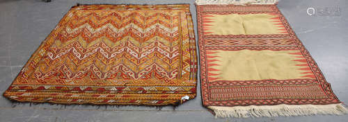 A Turkish flatweave rug, the yellow twin compartment field within a geometric border, 210cm x 110cm,