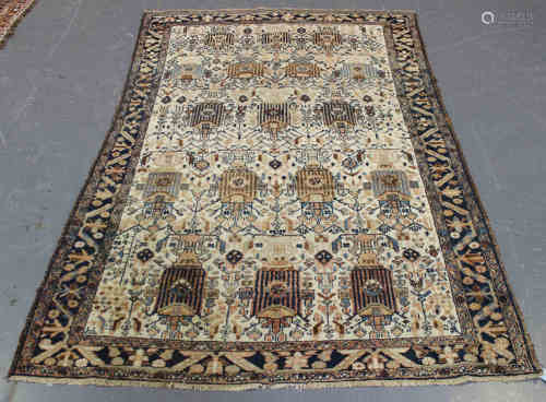 A Malayer rug, North-west Persia, mid-20th century, the ivory field with overall offset rows of
