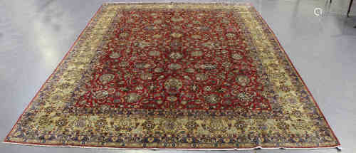 A fine Mashad carpet, Central Persia, late 20th century, the claret field with overall scrolling