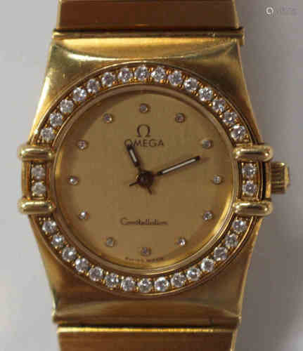An Omega Constellation 18ct yellow gold and diamond set lady's bracelet wristwatch, the signed