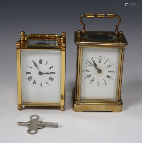 An early 20th century French brass cased carriage timepiece with glazed case and swing handle,