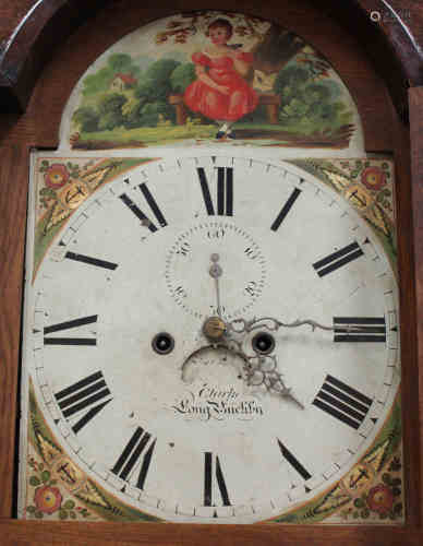 A George III oak longcase clock with mahogany crossbanding, the eight day movement striking on a