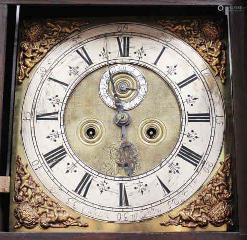 A George III oak longcase clock with eight day movement striking on a bell, the 12-inch square brass