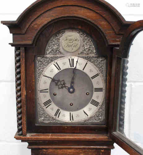 A George V oak diminutive longcase clock with eight day movement chiming on gongs, the breakarch