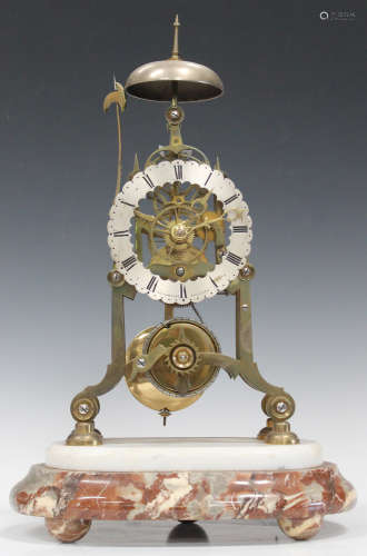 A late 19th century brass skeleton clock with single fusee movement striking on a bell, the silvered