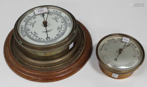 An early 20th century brass cased circular wall barometer, the dial detailed 'John Barker & Co Ltd