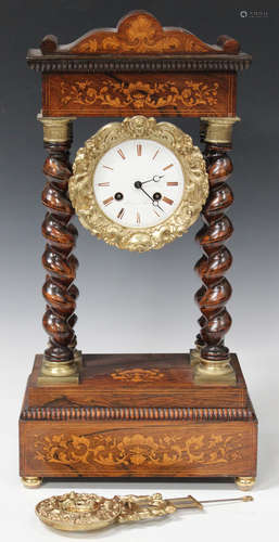 A 19th century French rosewood portico clock with eight day movement striking on a bell via an