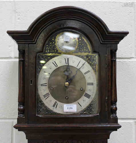 A mid-20th century oak longcase clock with eight day movement chiming on gongs, the dial with '