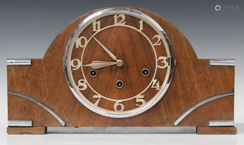 An Art Deco walnut cased mantel clock with chiming movement, the case with chrome mounts and