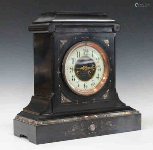 A late 19th century slate and marble inlaid mantel clock with eight day movement striking on a gong,