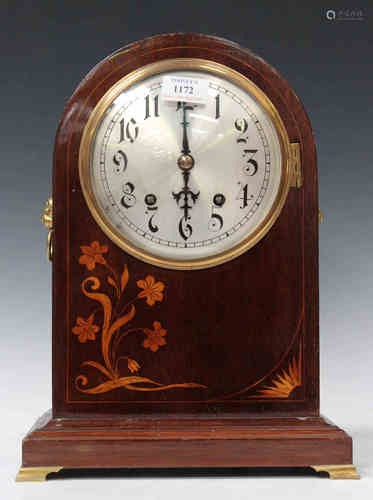 An early 20th century mahogany mantel clock with German eight day movement striking on two gongs,