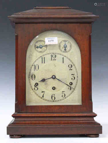 An early 20th century German mahogany cased mantel clock with eight day movement chiming on gongs,