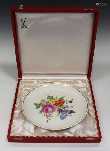 A Meissen porcelain cabinet plate, 20th century, painted with flowers within a gilt line border,