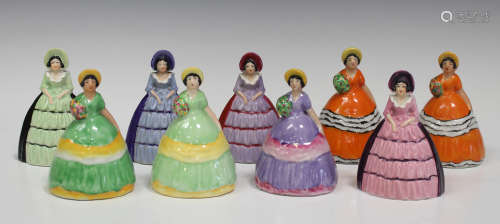 Nine Carlton Ware novelty crinoline lady napkin rings, including two matching pairs, heights ranging
