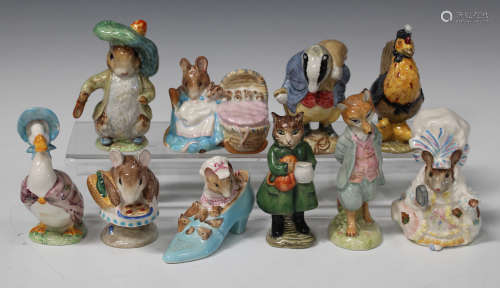 Ten Beswick Beatrix Potter figures, comprising 'Benjamin Bunny' and 'Hunca Munca', gold oval